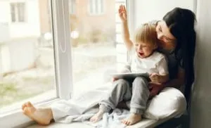 little-son-windowsill-min